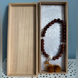 Japanese prayer beads in box.